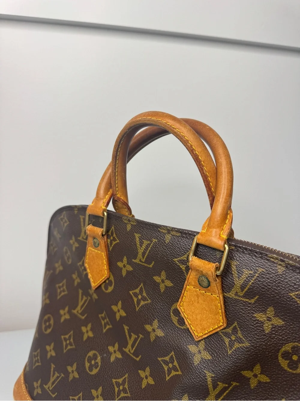 Authentic Louis Vuitton Classic Monogram Alma , Leather Top-Handle Bag in Brown
